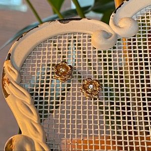 Delicate gold tone rose earrings with cz center